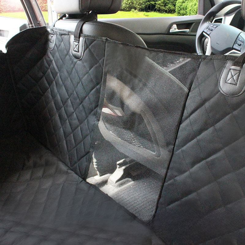 Car seat cover with a mesh pocket on the back seat of a vehicle